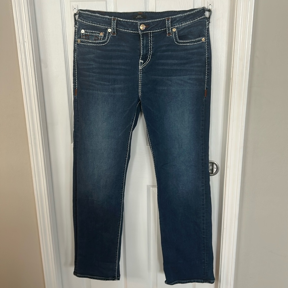 TRUE RELIGION Women’s jeans size “38” fits a 18 perfectly.